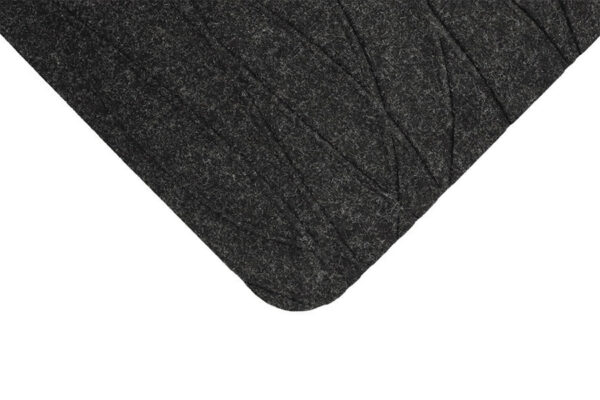 Close-up view of the corner of a dark gray felt TuffComfort Standing Desk Mat with stitched seam details against a white background.